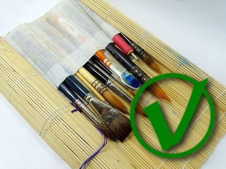 When transporting your brushes, store them in a brush wrap, canvas brush holder